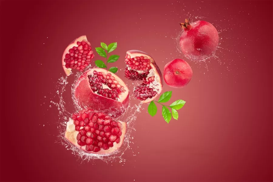 Free Premium Stock Photos Water splashing on Ripe pomegranate fruit on red background
